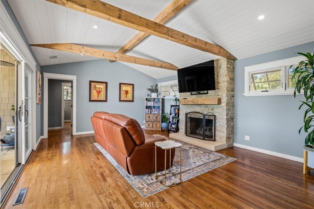 27064 Sunnyridge Road Palos Verdes Peninsula, CA 90274 - Photo 54 of 57 a living room with furniture a flat screen tv and a fireplace