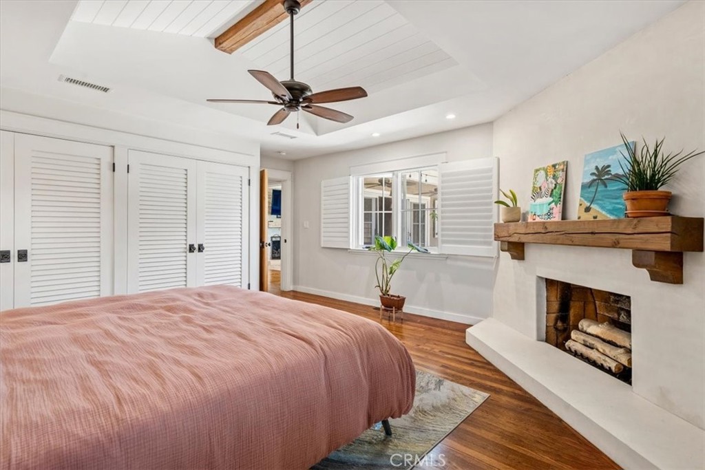 27064 Sunnyridge Road Palos Verdes Peninsula, CA 90274 - Photo 57 of 57 a bedroom with a bed a fireplace and a chandelier