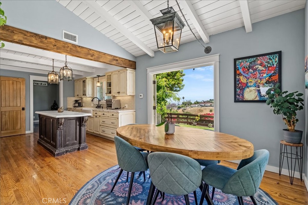 27064 Sunnyridge Road Palos Verdes Peninsula, CA 90274 - Photo 7 of 57 a dining room with furniture a potted plant and a large window