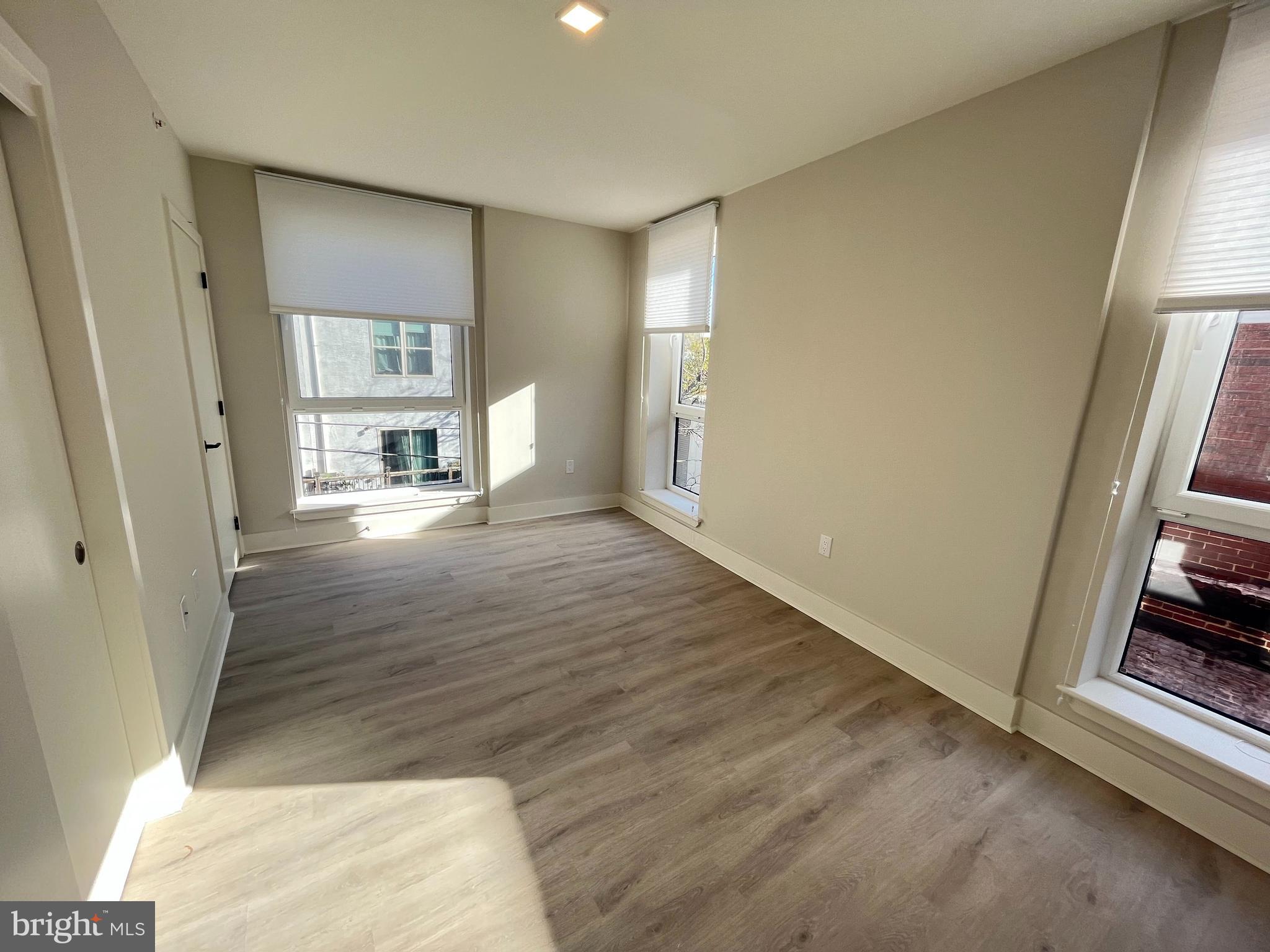 1805 North Howard Street, Unit 303 Philadelphia, PA 19122 - Photo 21 of 25 a view of empty room with wooden floor