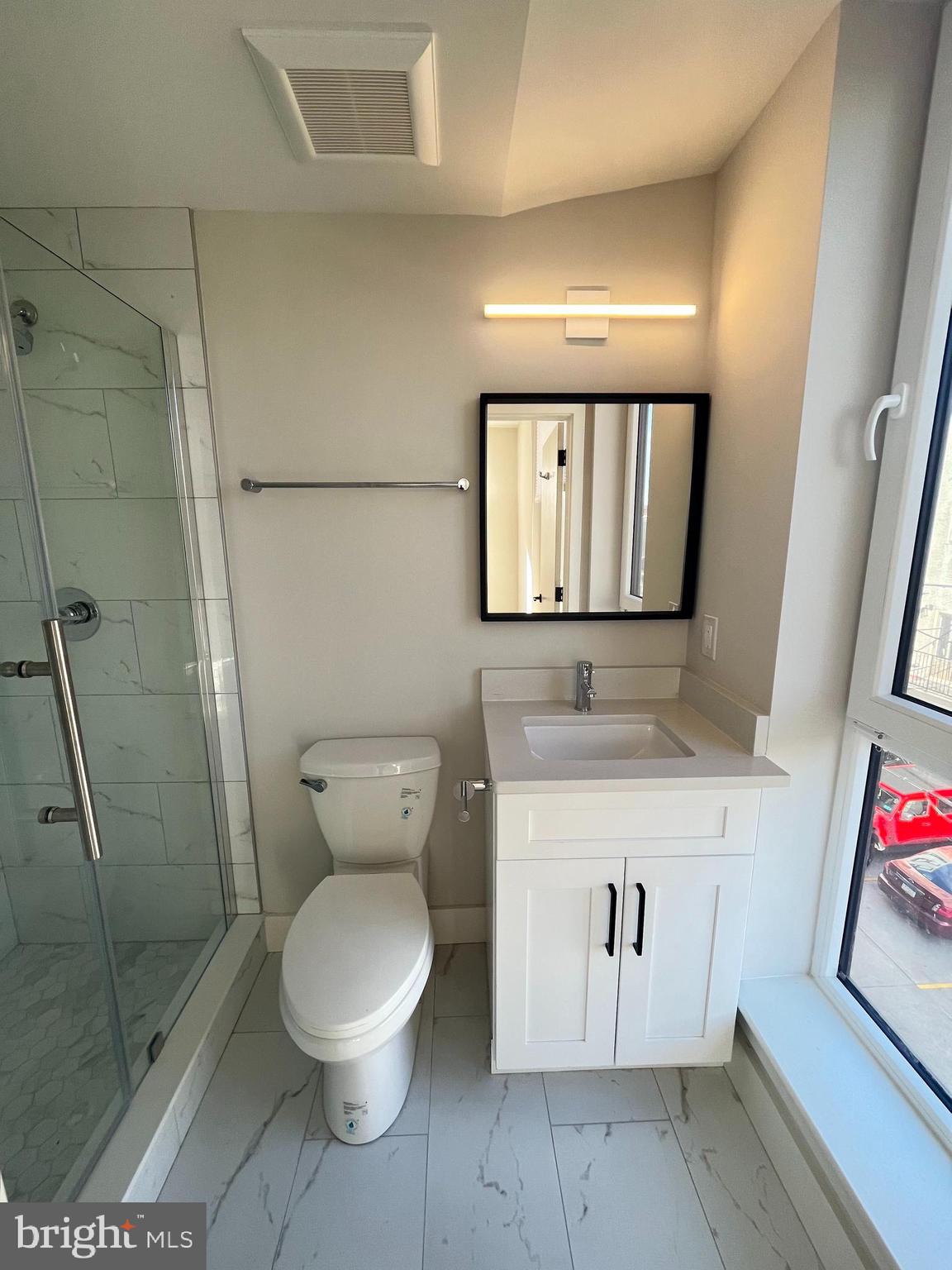 1805 North Howard Street, Unit 303 Philadelphia, PA 19122 - Photo 23 of 25 a bathroom with a toilet and a shower