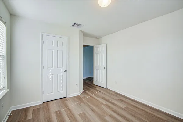 a view of an empty room and window