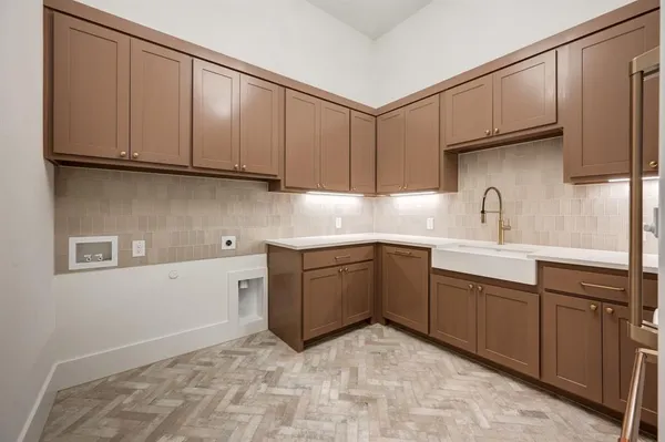 a kitchen with sink cabinets and window