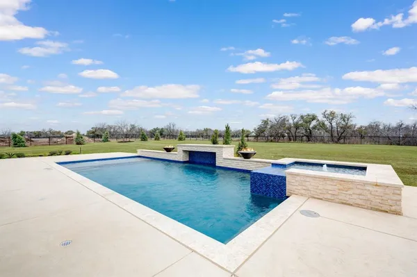 a view of swimming pool with outdoor seating and city view