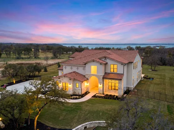 a view of a big yard in front of a house with a yard