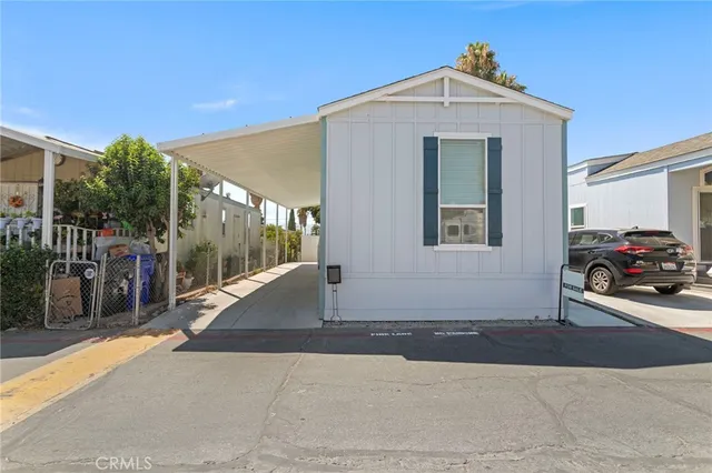 a view of a car park in front of house