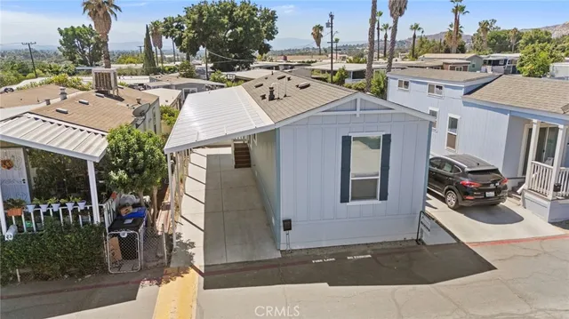 an aerial view of a residential houses with outdoor space