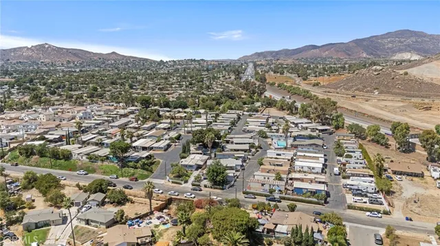 an aerial view of residential houses with city view