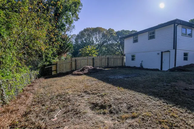 a backyard of a house with lots of green space
