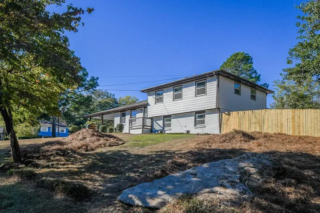 a view of a house with a yard