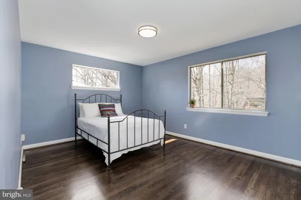 a room with a bed and a window