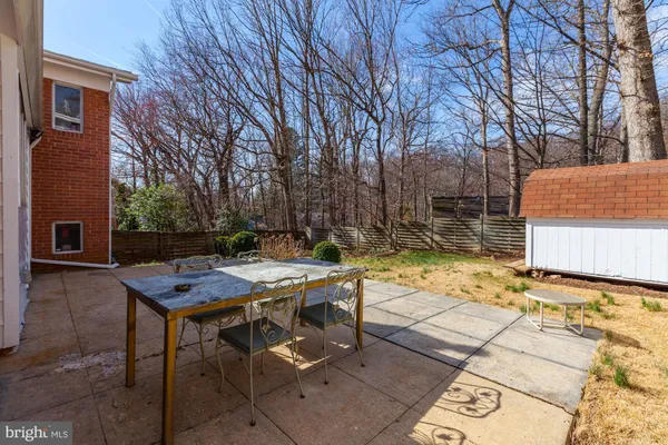 a view of a backyard with sitting area