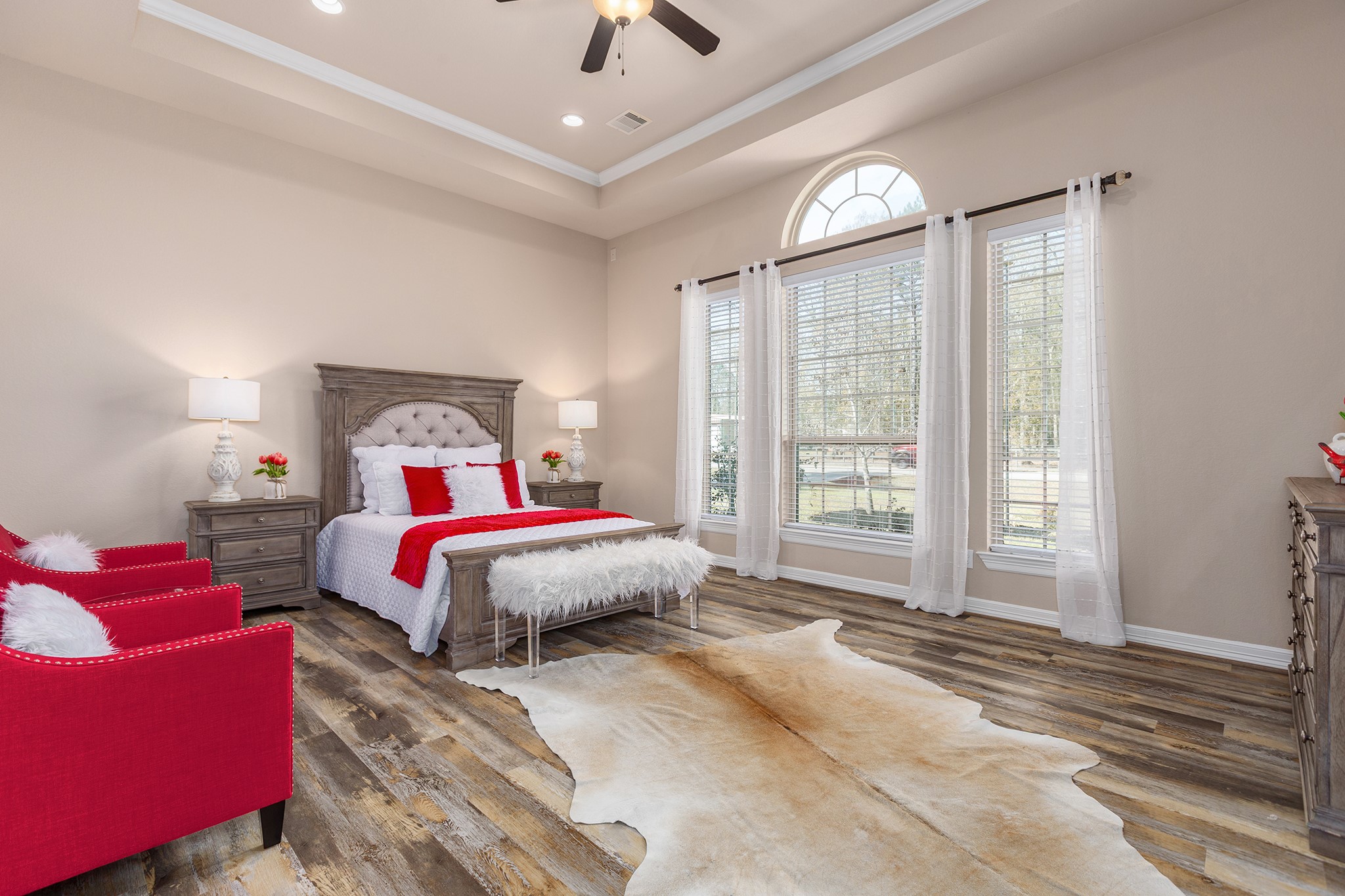 27688 Rio Blanco Drive Splendora, TX 77372 - Photo 22 of 50 a bedroom with a large bed and a large window