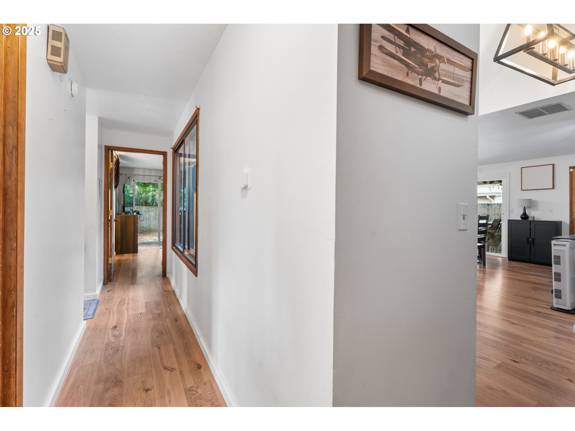 2356 B Street Hubbard, OR 97032 - Photo 18 of 32 a view of a hallway with wooden floor fireplace and living room