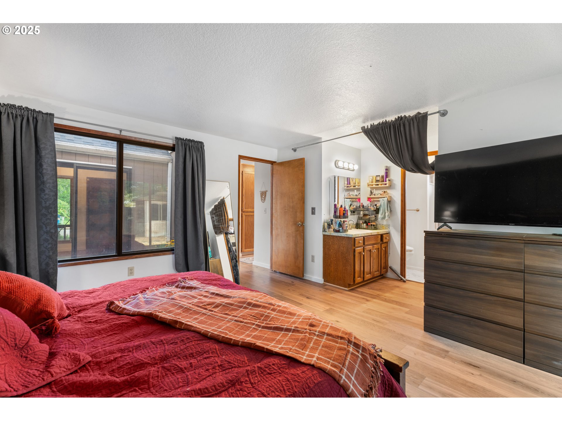 2356 B Street Hubbard, OR 97032 - Photo 26 of 32 a bedroom with a bed and a large window