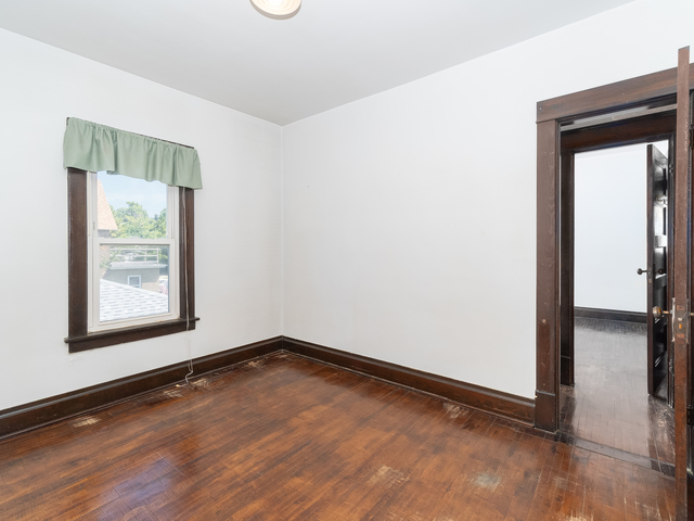 121 Davis Avenue, Unit 2 Rockdale, IL 60436 - Photo 5 of 11 a view of a room with wooden floor and a window