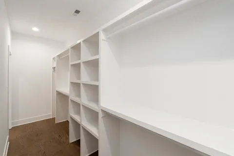 a view of an empty walk in closet