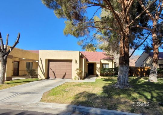 328 Del Mar Lane Ridgecrest, CA 93555 - Photo 1 of 12 a front view of a house with a yard