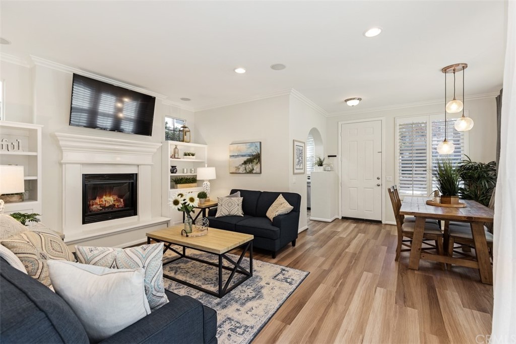 1 Irish Moss Street Ladera Ranch, CA 92694 - Photo 1 of 1 a living room with furniture a flat screen tv and a fireplace