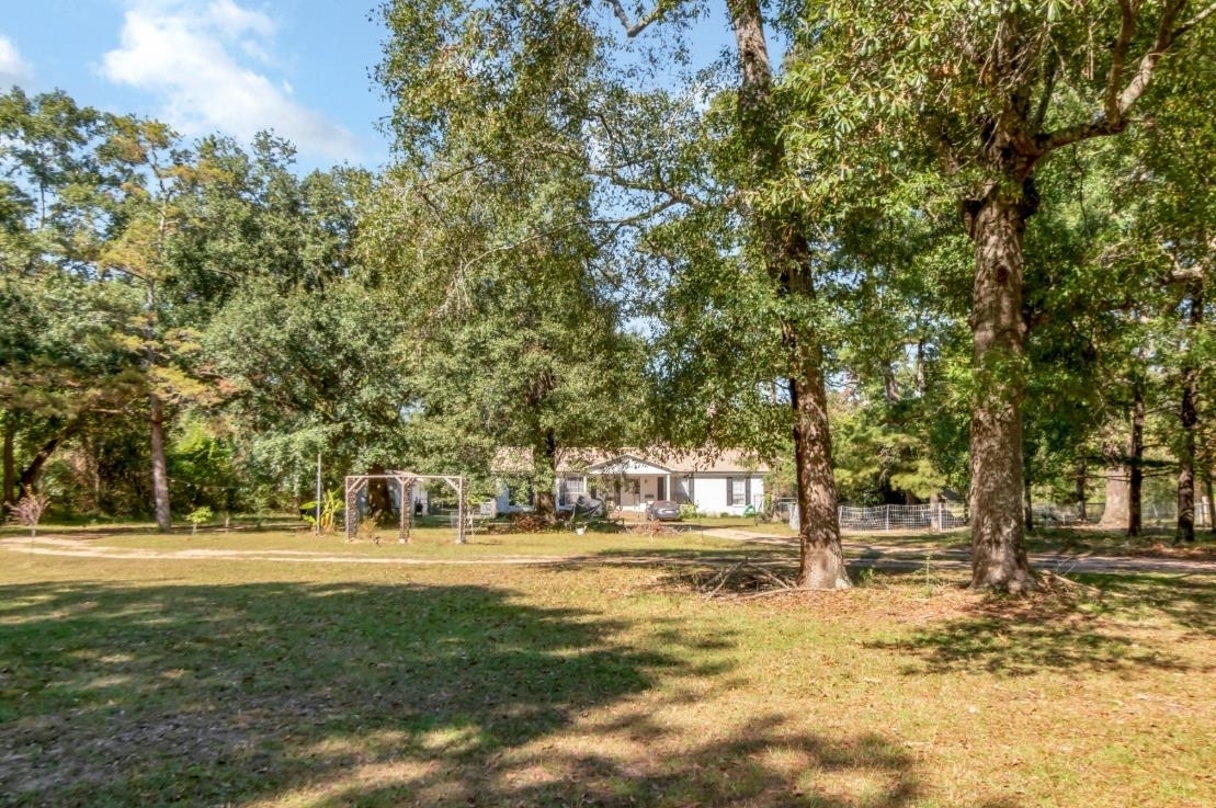 6405 1st Street Wilmer, AL 36587 - Photo 1 of 38 View of grassy yard featuring view of scattered trees