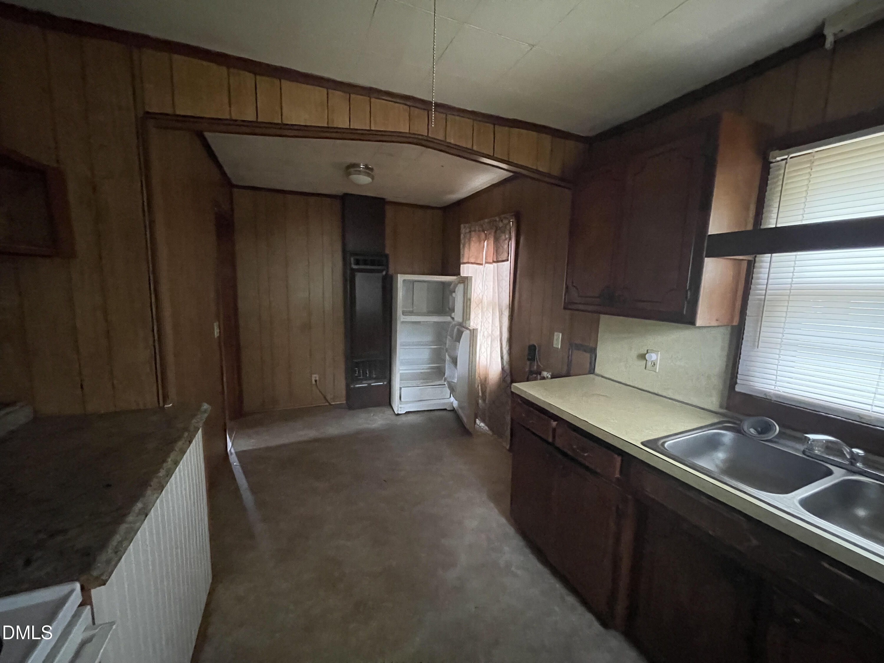 1023 Leasburg Road Roxboro, NC 27573 - Photo 6 of 12 a kitchen that has a sink and a stove