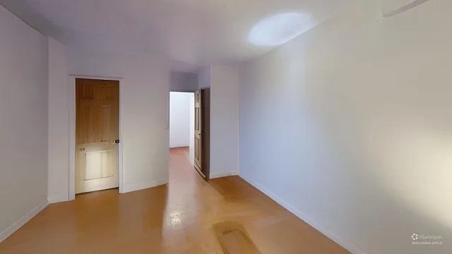 a view of an empty room and window