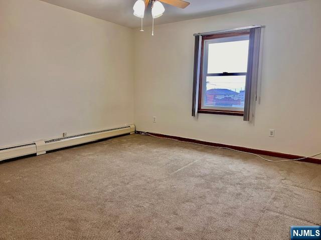 225 6th Street, Unit 2 Fairview, NJ 07022 - Photo 13 of 14 an empty room with a window
