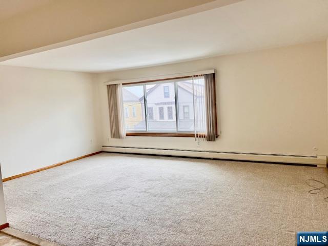 225 6th Street, Unit 2 Fairview, NJ 07022 - Photo 4 of 14 an empty room with windows