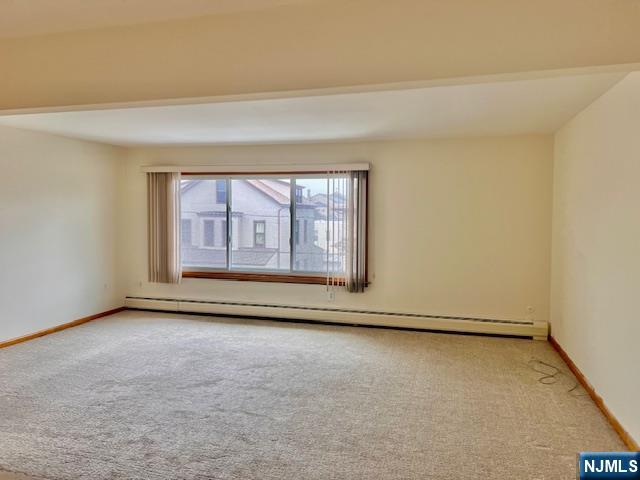 225 6th Street, Unit 2 Fairview, NJ 07022 - Photo 5 of 14 an empty room with large window