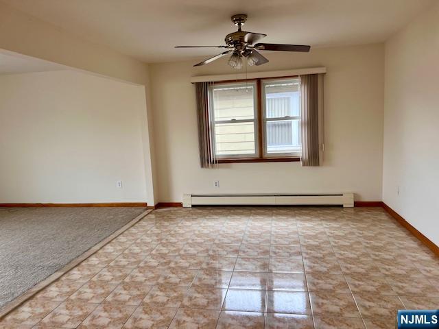 225 6th Street, Unit 2 Fairview, NJ 07022 - Photo 6 of 14 a view of an empty room with a window