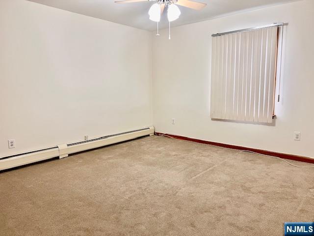 225 6th Street, Unit 2 Fairview, NJ 07022 - Photo 8 of 14 an empty room with a window