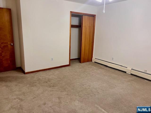 225 6th Street, Unit 2 Fairview, NJ 07022 - Photo 9 of 14 an empty room with closet