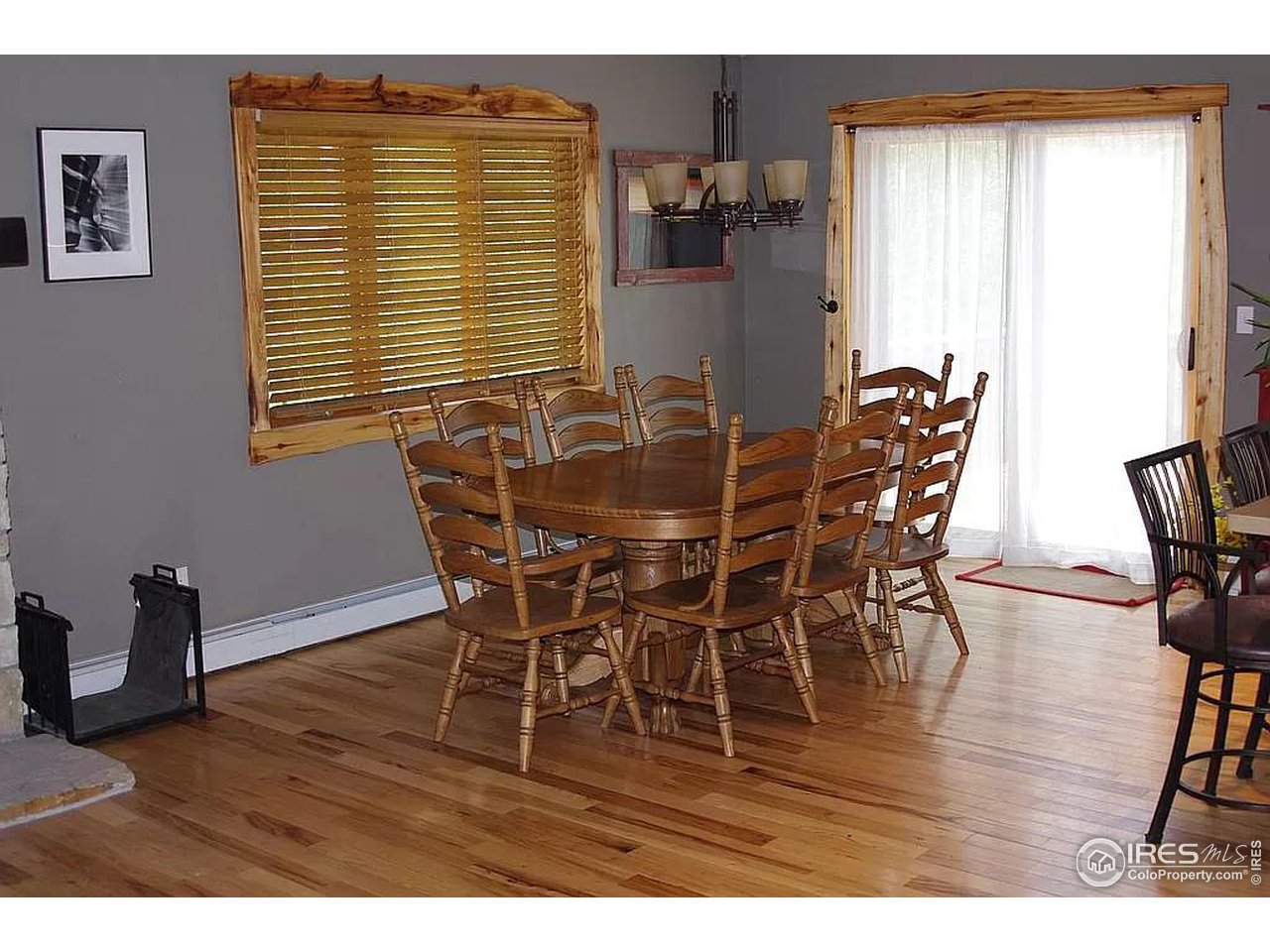 16705 Rist Canyon Road Bellvue, CO 80512 - Photo 14 of 25 a view of a dining room with furniture and wooden floor