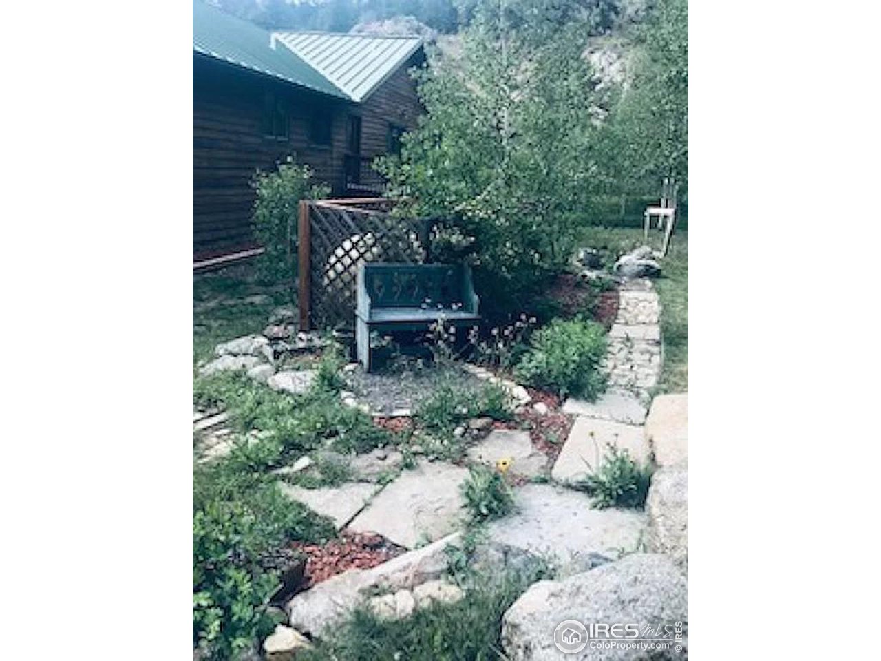 16705 Rist Canyon Road Bellvue, CO 80512 - Photo 10 of 25 a view of backyard with outdoor seating and plants