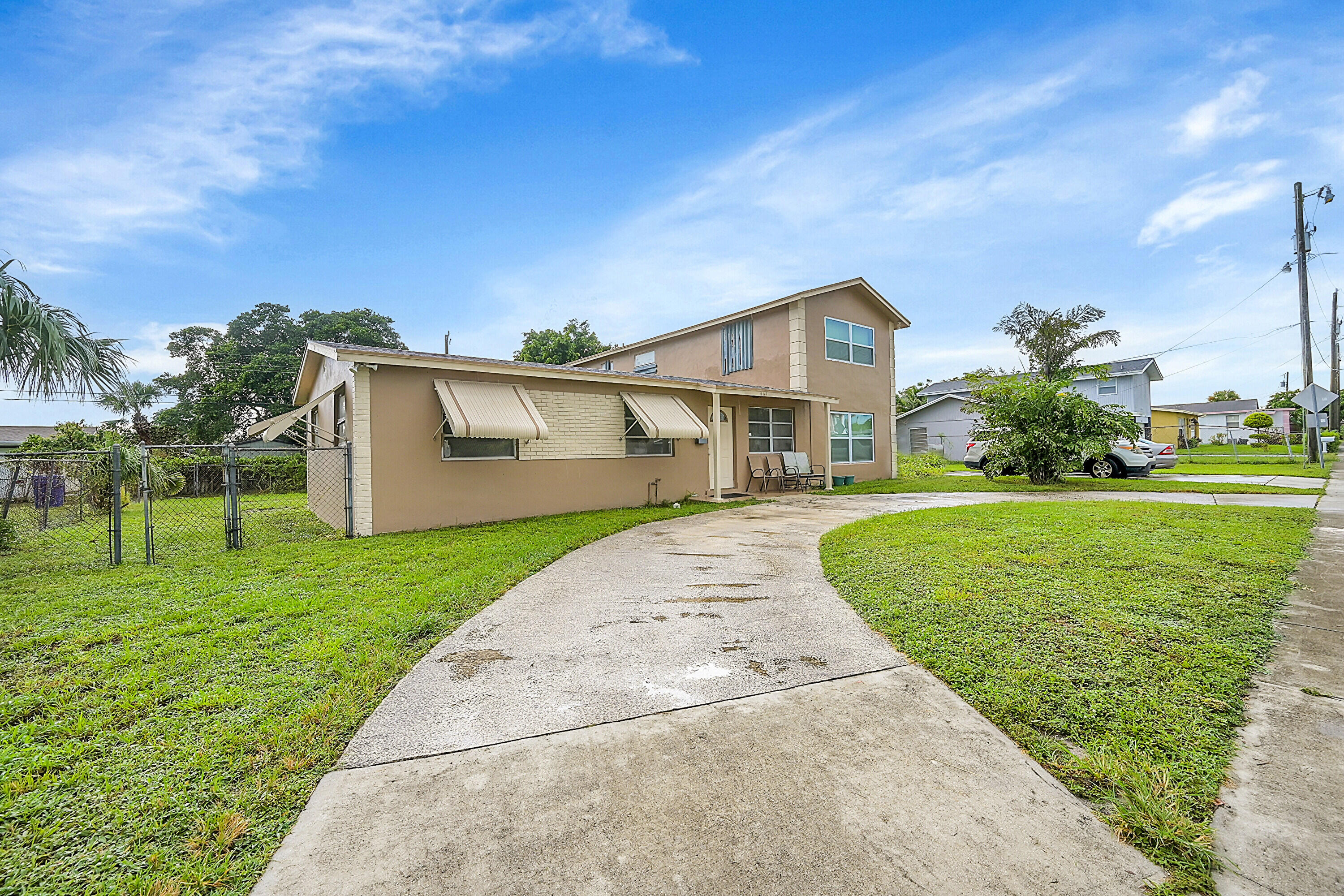 1445 West 34th Street Riviera Beach, FL 33404 - Photo 2 of 23 02_front yard