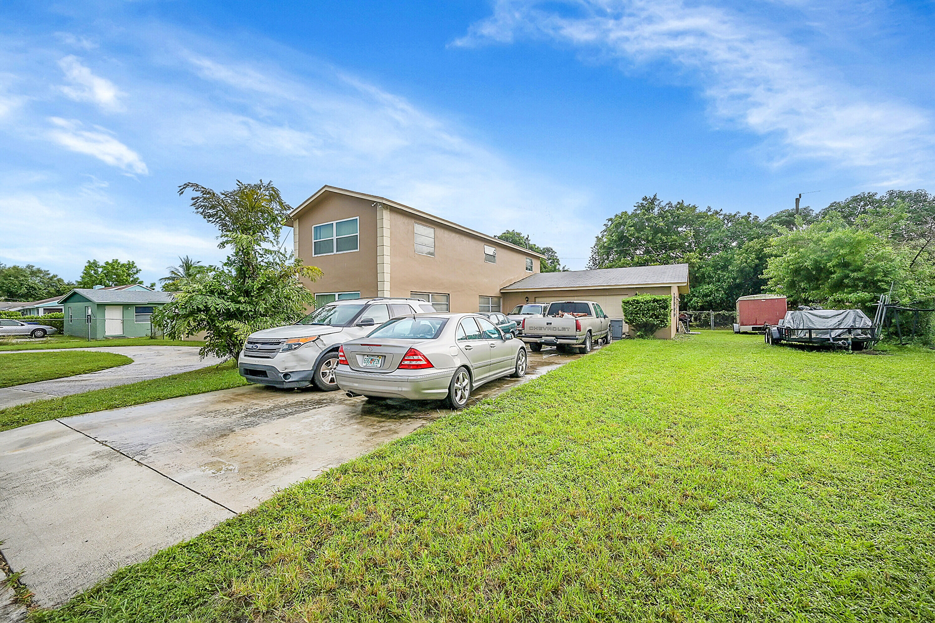1445 West 34th Street Riviera Beach, FL 33404 - Photo 3 of 23 03_front yard