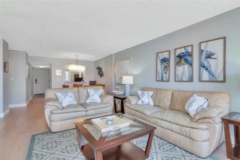 a bedroom with a large bed and a large window