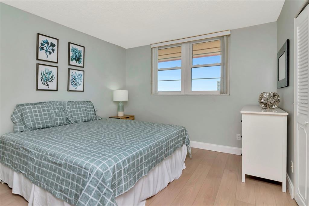 17580 Gulf Boulevard, Unit 403 Redington Shores, FL 33708 - Photo 17 of 27 a bedroom with a bed and a window