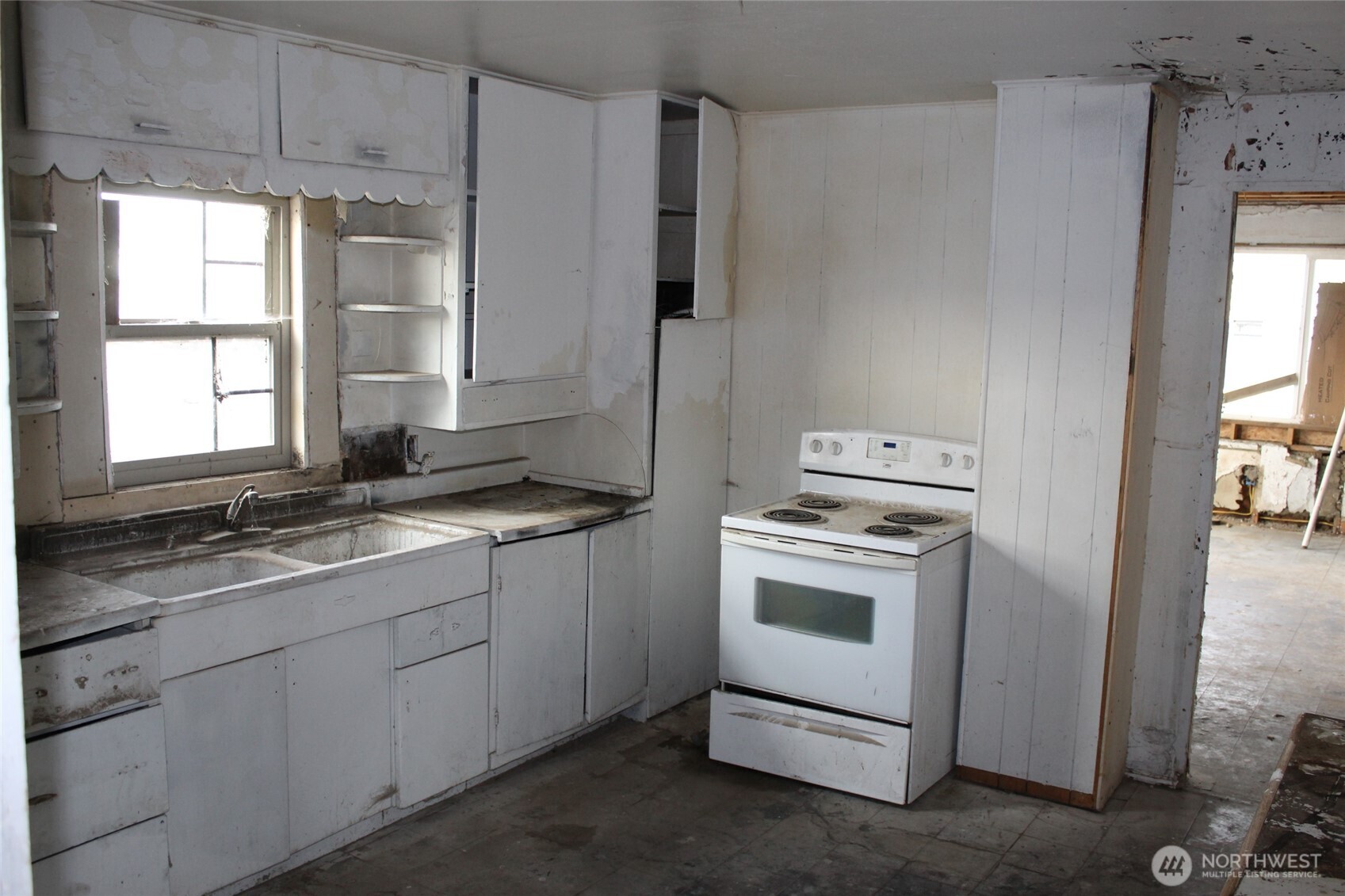 113 Lutcher Avenue Lind, WA 99341 - Photo 7 of 13 a kitchen with a sink stove and refrigerator