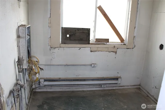 a view of an empty room with a window