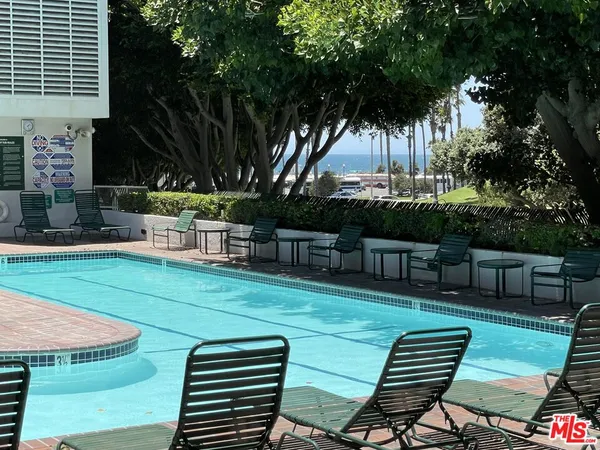 a view of a chairs and table in the patio