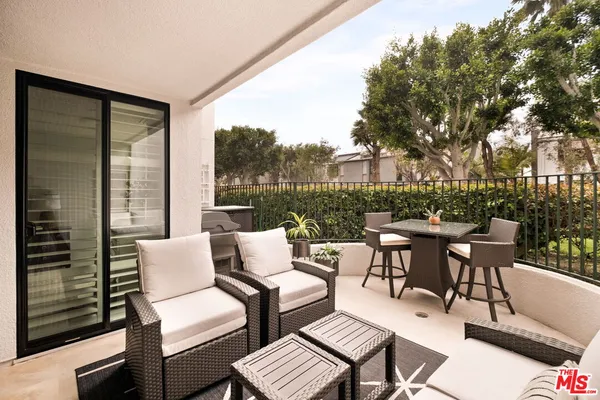 a view of a patio with a yard