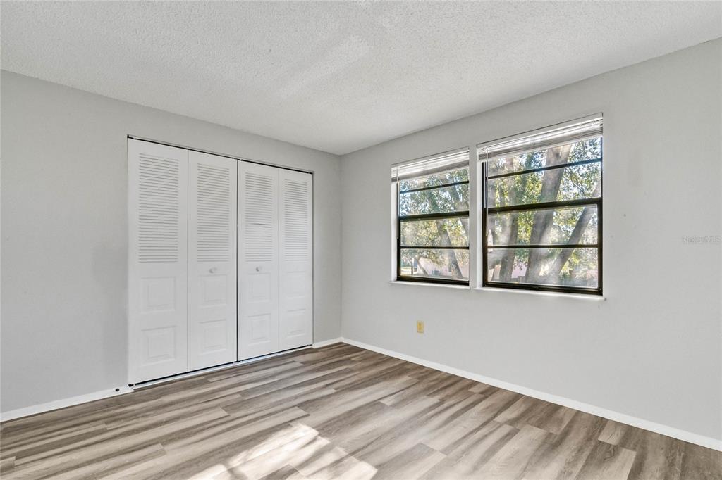 4907 Lake Ridge Road, Unit H Orlando, FL 32808 - Photo 12 of 14 a view of an empty room with a window