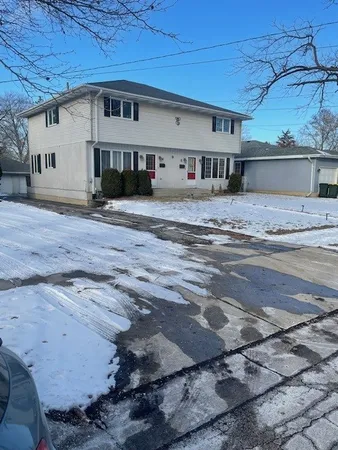 a view of a house with a road