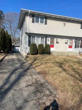 a view of a house with a yard
