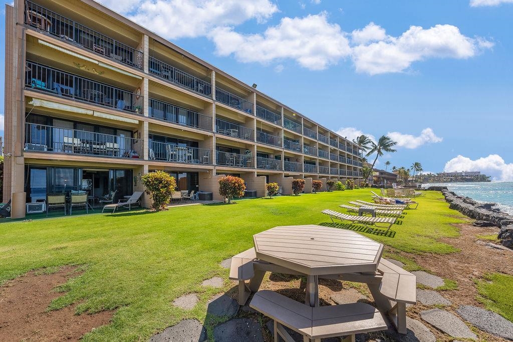 3785 Lower Honoapiilani Road, Unit 208 Lahaina, HI 96761 - Photo 43 of 50 a view of an chairs and table in the patio
