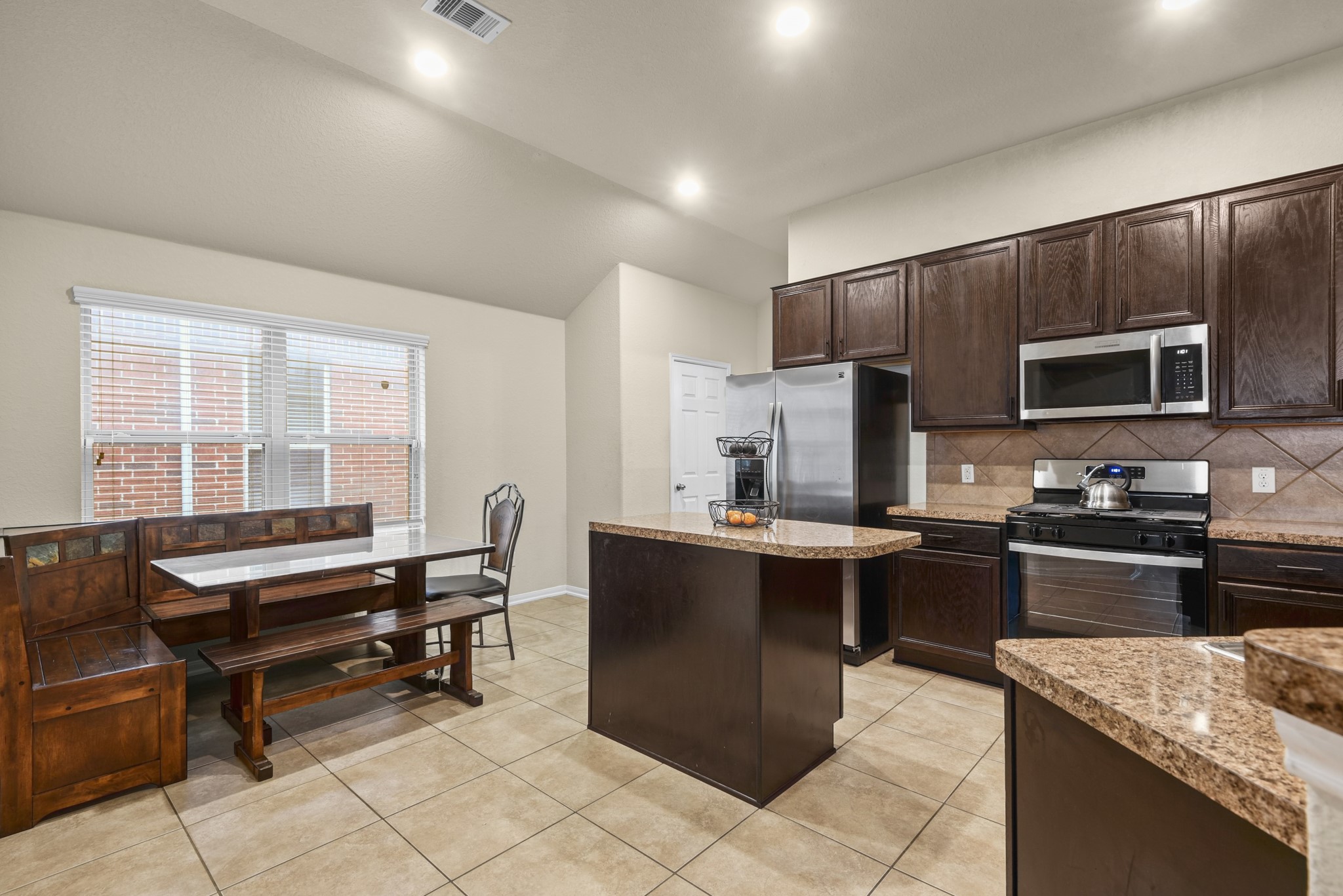 5211 Cayenne Lane Baytown, TX 77521 - Photo 6 of 19 This kitchen features an island and space to dine in.