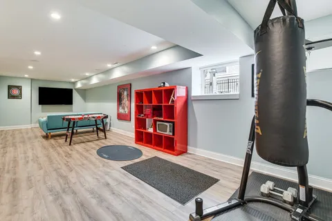 a room with furniture and gym equipment
