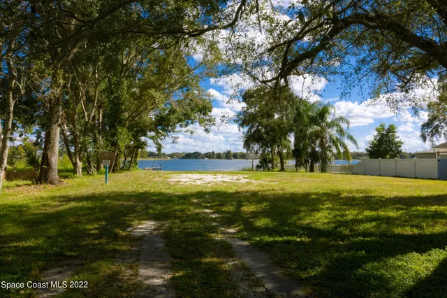 a view of a field with an trees