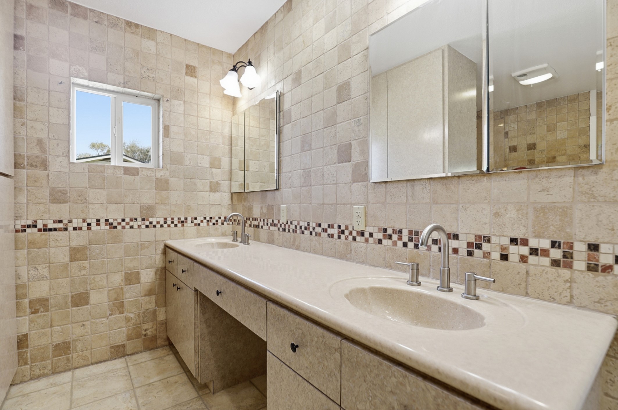 128 Skyview Terrace Leander, TX 78641 - Photo 15 of 23 Bathroom with double vanity, tile walls, and light tile patterned flooring